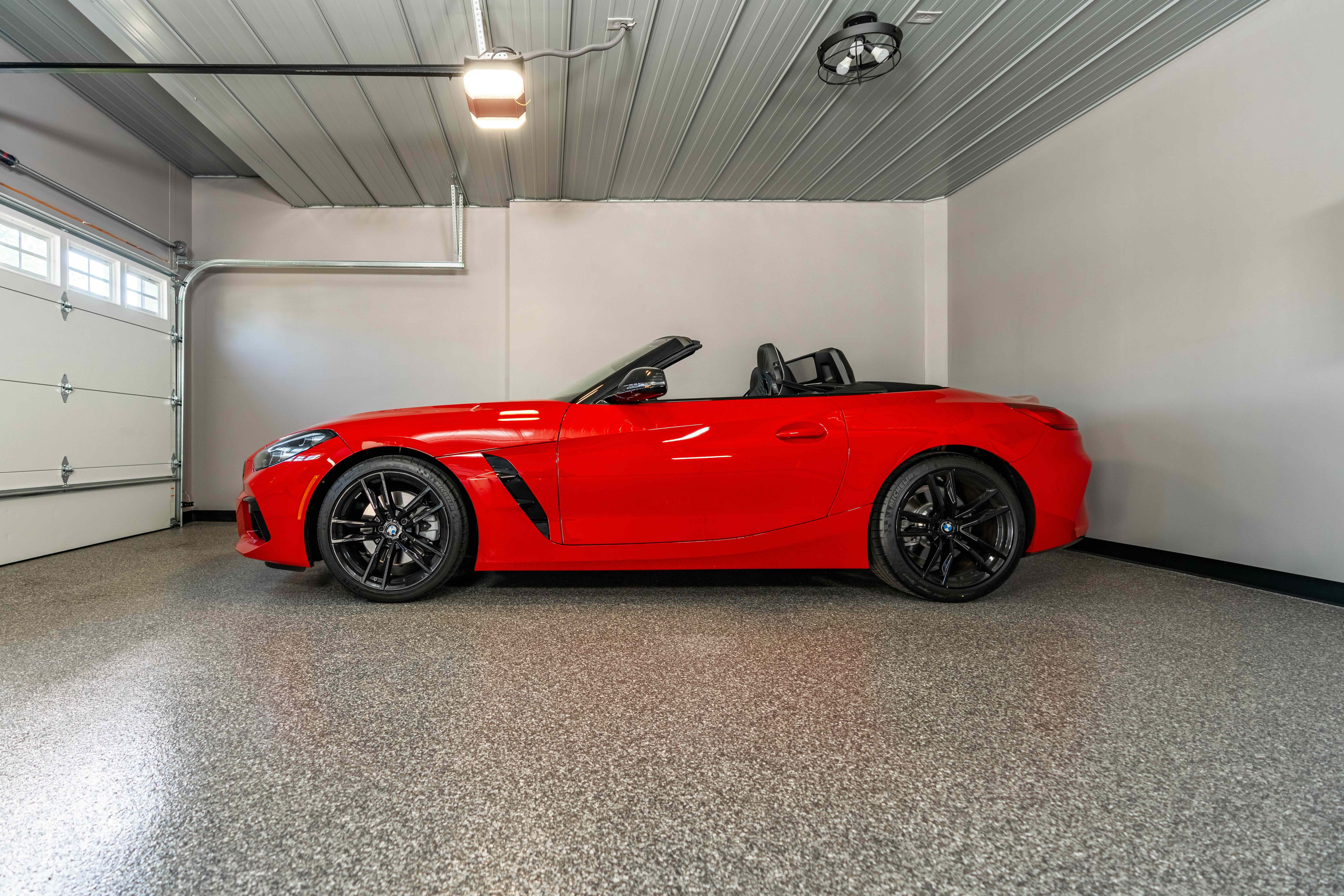 Garage coating with red car.