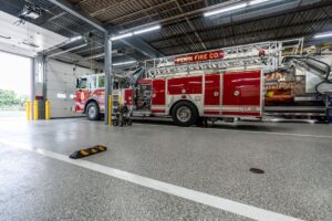 polyurea coated concrete; industrial floors with firetruck in firehouse