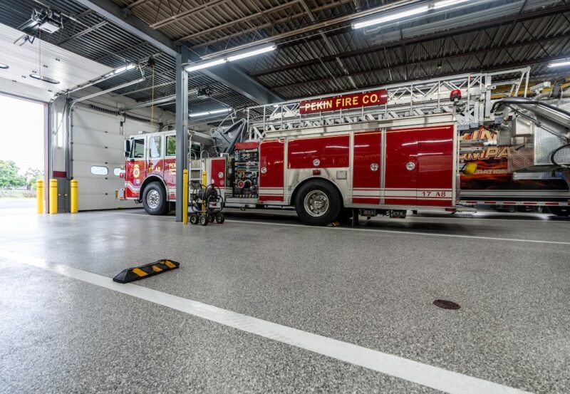 polyurea coated concrete; industrial floors with firetruck in firehouse