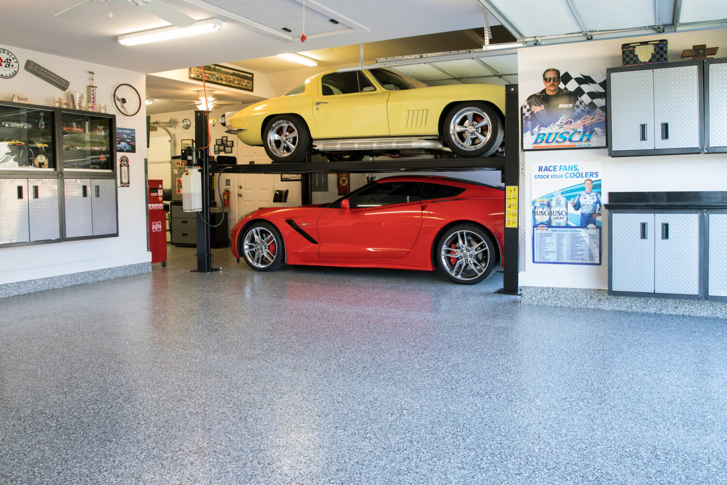 Corvettes on coated garage floor.